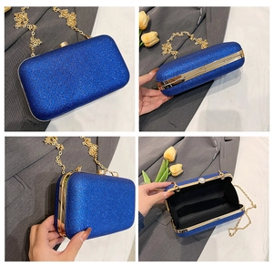 Detailed views of a blue sequined hard shell evening bag with golden chain and clasp