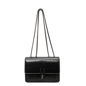 Classic black leather crossbody bag with chain strap and white contrast stitching