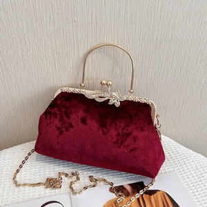 Elegant wine red velvet evening clutch bag with gold handle and rhinestone butterfly accent