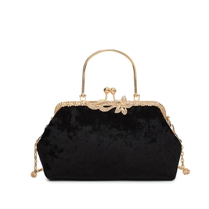 Elegant black velvet evening bag with gold floral clasp and metal handle for women