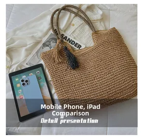 Detail showing woven straw tote bag size compared to a tablet and smartphone