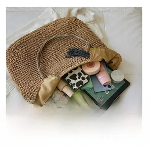 Detailed interior of a woven straw tote bag showing spacious capacity for summer items