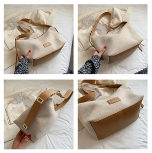 Detailsicht der beigen Canvas-Tasche mit braunem Lederbesatz und verstellbarem Gurt