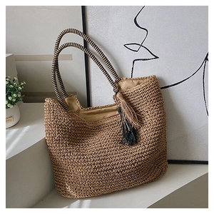 Minimalist woven straw tote bag with striped handles and decorative bicolor tassels