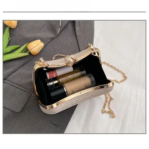 Champagne gold evening clutch showing interior space for lipstick and makeup items