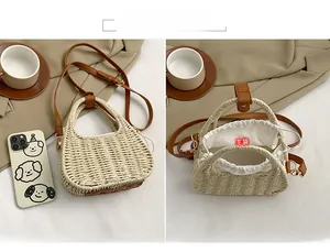 Detail view of woven straw bag with leather straps and drawstring liner interior