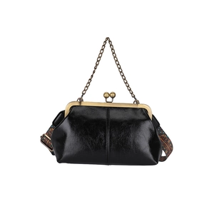 Retro black leather handbag with bronze clasp and colorful woven shoulder strap