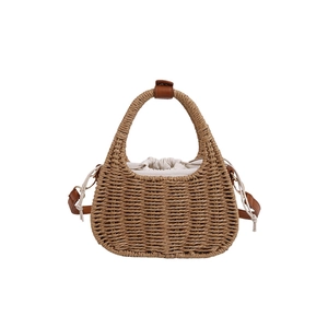 French retro straw shoulder bag with woven handle and leather strap in minimalist style