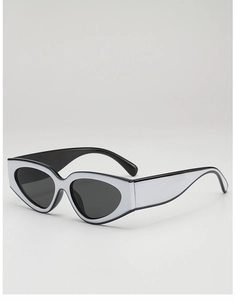 Détail de lunettes de soleil œil-de-chat vintage avec monture bicolore blanc et noir