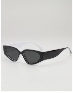 Détails de lunettes de soleil rétro œil de chat avec monture contrastée noir et blanc