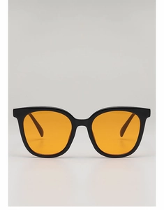 Close-up of thick black frame sunglasses with vibrant orange tinted square lenses