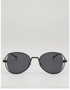 Close-up of vintage round sunglasses featuring a unique double-line hollow metal frame