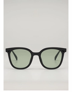 Front detail of vintage square sunglasses with thick black frames and mint green lenses