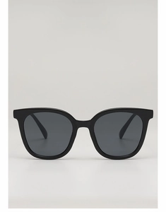 Detail view of square black frame sunglasses with dark gray tinted lenses for sun protection