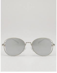 Close-up of retro silver metallic sunglasses with round mirrored lenses and nose pads