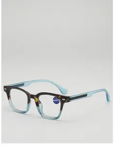 Close-up of tortoise and blue anti-blue light reading glasses with +1.00 strength label