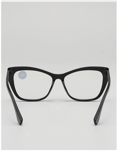 Detail of black cat-eye reading glasses with +1.00 strength label on transparent lens