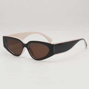 Lunettes de soleil cat eye vintage avec monture extérieure noire et intérieur crème