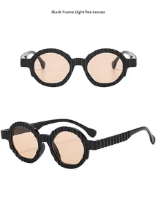 Macro detail of thick black striped sunglasses frames with premium light tea lenses
