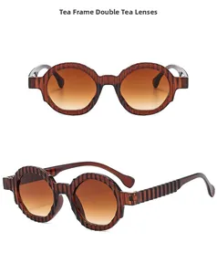 Detail of vintage brown round sunglasses with unique vertical stripe texture on frames