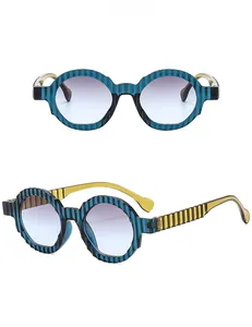 Macro view of blue wave-textured frames with grey-blue gradient lenses on sunglasses