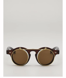 Vue de face de lunettes de soleil steampunk rondes à double couche avec monture dorée