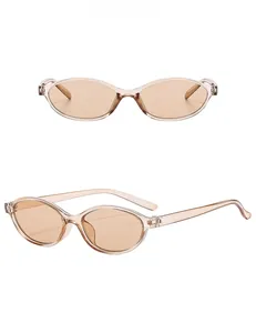 Detail view of oval retro light tea sunglasses with translucent frames and matching lenses