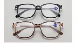 Blue light blocking reading glasses in black and tawny frames with metal T-shaped detail