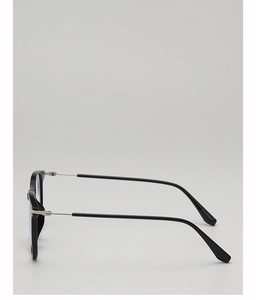 Detailed view of black eyeglass frame with silver metal hinges and anti-slip temples