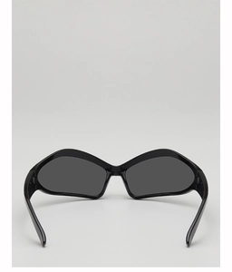 Low-angle back view of black vintage wrap-around sunglasses with glossy resin frames