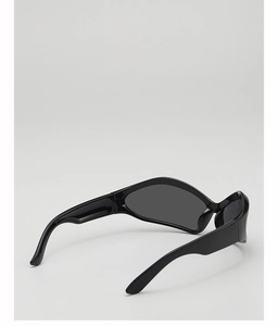 Detail of kids black wrap-around sunglasses with wide temples and grey lenses