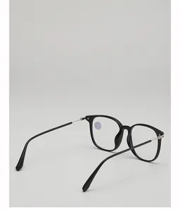 Detailed close-up of premium black and silver anti-blue light reading glasses with metal hinges