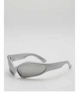 Close-up of silver futuristic kids' sunglasses with sleek streamlined frame and metallic finish
