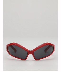 Detailed view of kids vintage butterfly sunglasses with glossy red frame and dark lenses