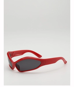 Detailed view of red retro sunglasses for kids with grey lenses and cat-eye frame