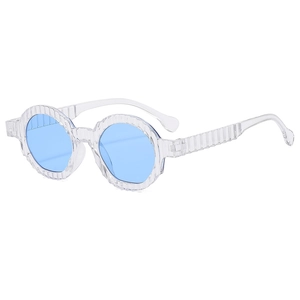 Oversized round sunglasses with light blue lenses and transparent textured frames