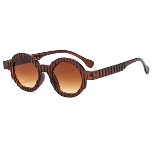 Retro amber round frame sunglasses with wavy texture and brown gradient lenses