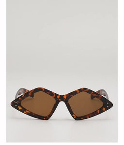 Détail de lunettes de soleil vintage à monture losange en écaille et verres marron