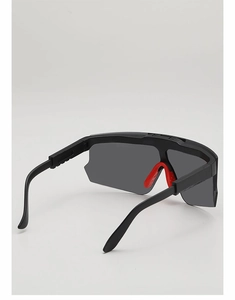 Close-up of kids cycling glasses with black frame and red anti-slip nose pads