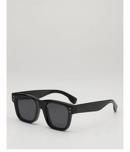 Detail view of retro black square sunglasses with silver dot accents and dark grey lenses