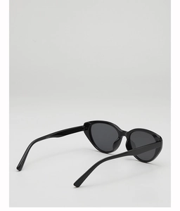 Detailed close-up of vintage cat-eye sunglasses with polished black frames and model code CY5571