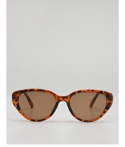 Detail of vintage cat-eye sunglasses with tortoise frame and brown lenses