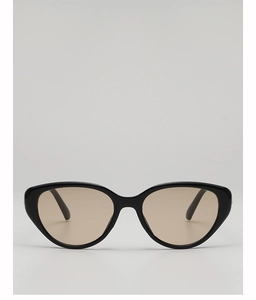 Close-up of retro cat-eye sunglasses with glossy black frames and tinted brown lenses