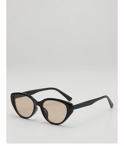 Detailed 45-degree angle of vintage black cat-eye sunglasses with brown tinted lenses