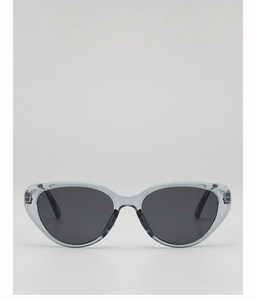 Macro shot of stylish smoke grey cat-eye sunglasses with translucent frames and grey lenses
