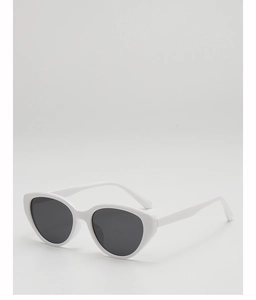 Side view of white cat-eye sunglasses with dark lenses on a white background