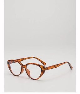 Detail of vintage cat-eye sunglasses featuring tortoiseshell pattern and clear lenses