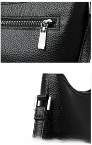 Close-up of durable silver-plated hardware and litchi texture leather detail