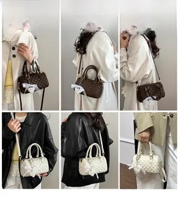 Quilted boston bag shown in multiple carry styles with pearl charms and lace bows