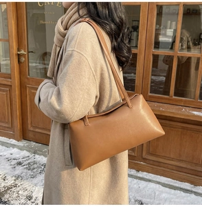 Caramel minimalist PU leather shoulder bag styled with a beige autumn cashmere coat